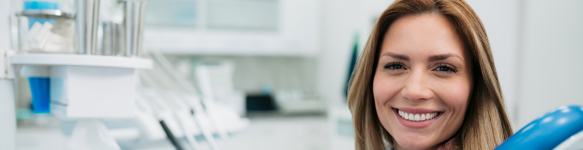 smiling woman sitting in a dental chair